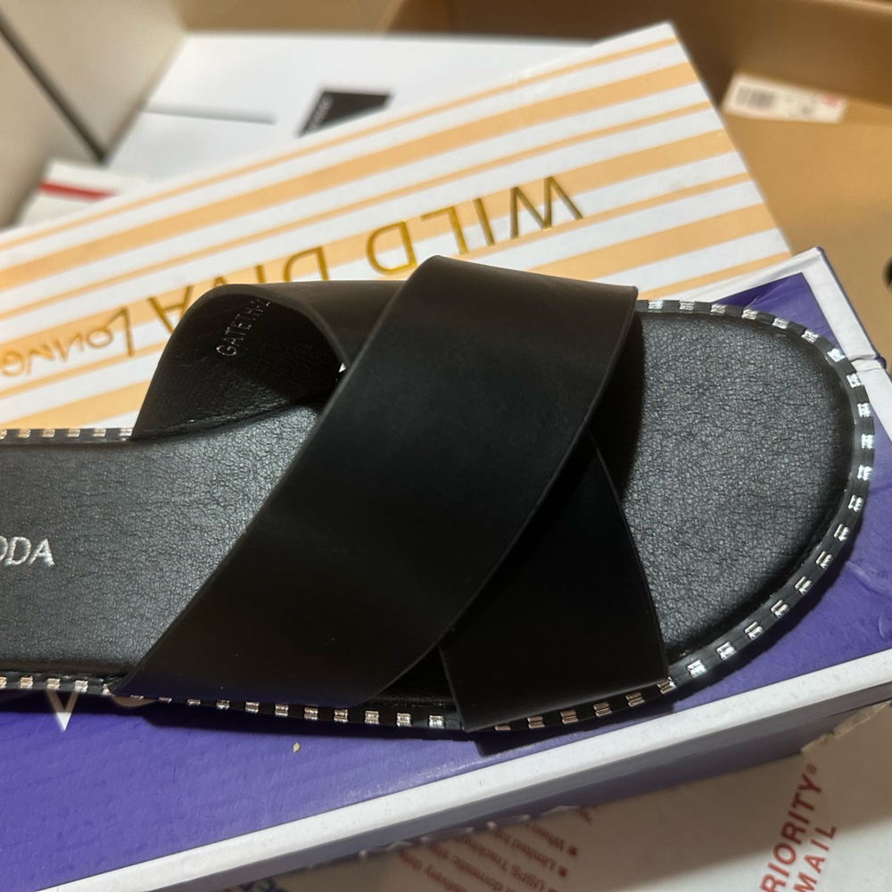 Women’s black slide with silver accent trim